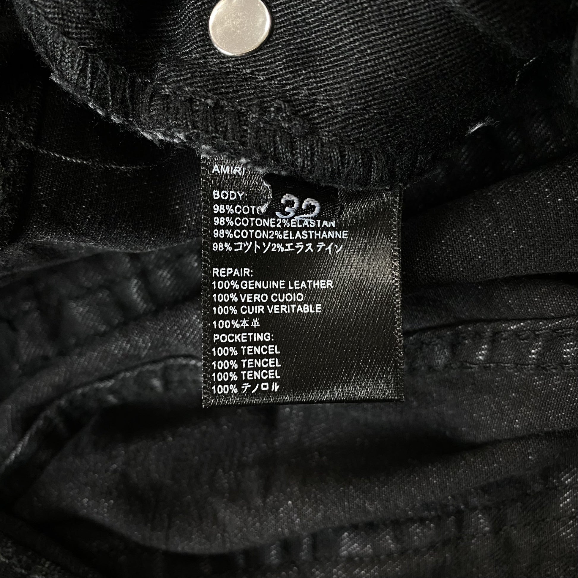 AMIRI VARSITY LOGO REPAIR JEANS