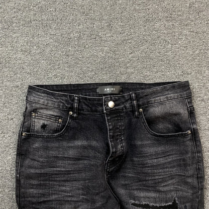 AMIRI VARSITY LOGO REPAIR JEANS